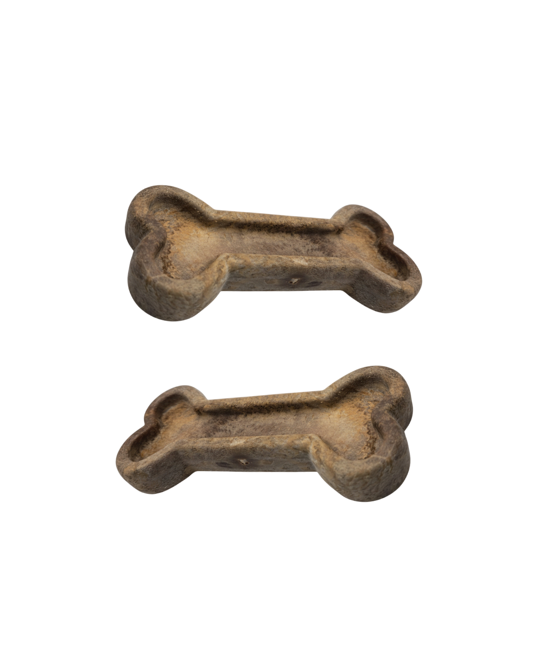 Two brown bone-shaped dog treats on a white background